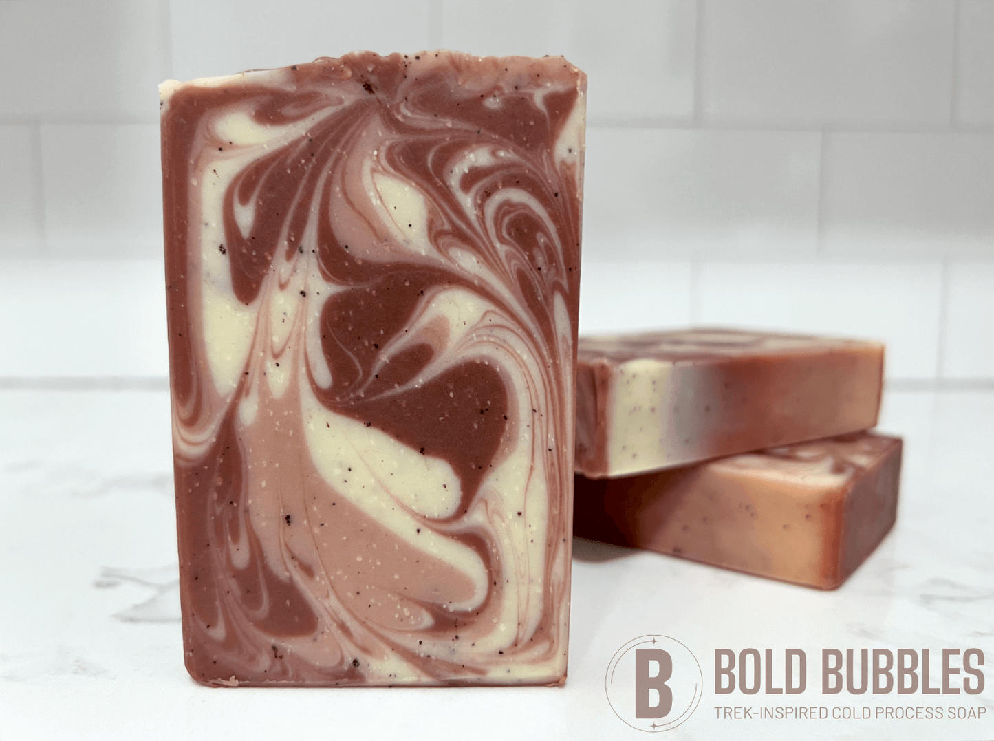 Bars of coffee soap with various shades of brown and cream-colored swirls. They smell like a cafe latte, and they are inspired by Captain Janeway's obsession with coffee on Star Trek: Voyager and Star Trek: Prodigy.