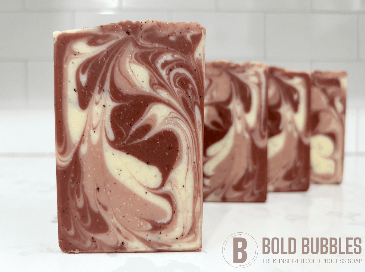 Bars of coffee soap with various shades of brown and cream-colored swirls. They smell like a cafe latte, and they are inspired by Captain Janeway's obsession with coffee on Star Trek: Voyager and Star Trek: Prodigy.