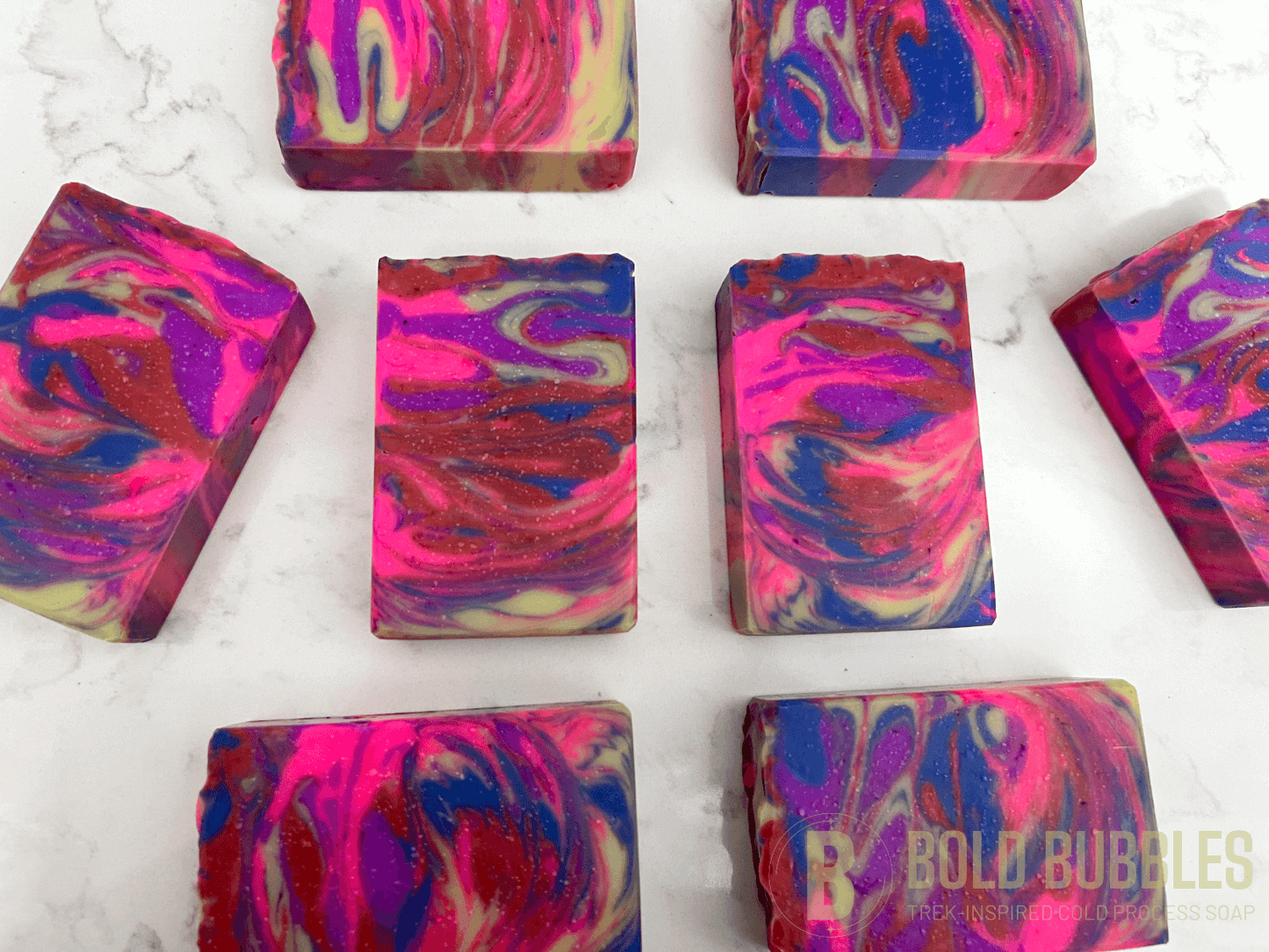 The swirled colors of this soap are inspired by the bright colors of Jake Sisko's attire on Star Trek: Deep Space Nine. The scent is "orange paradise," a ray of sunshine for your sonic shower!