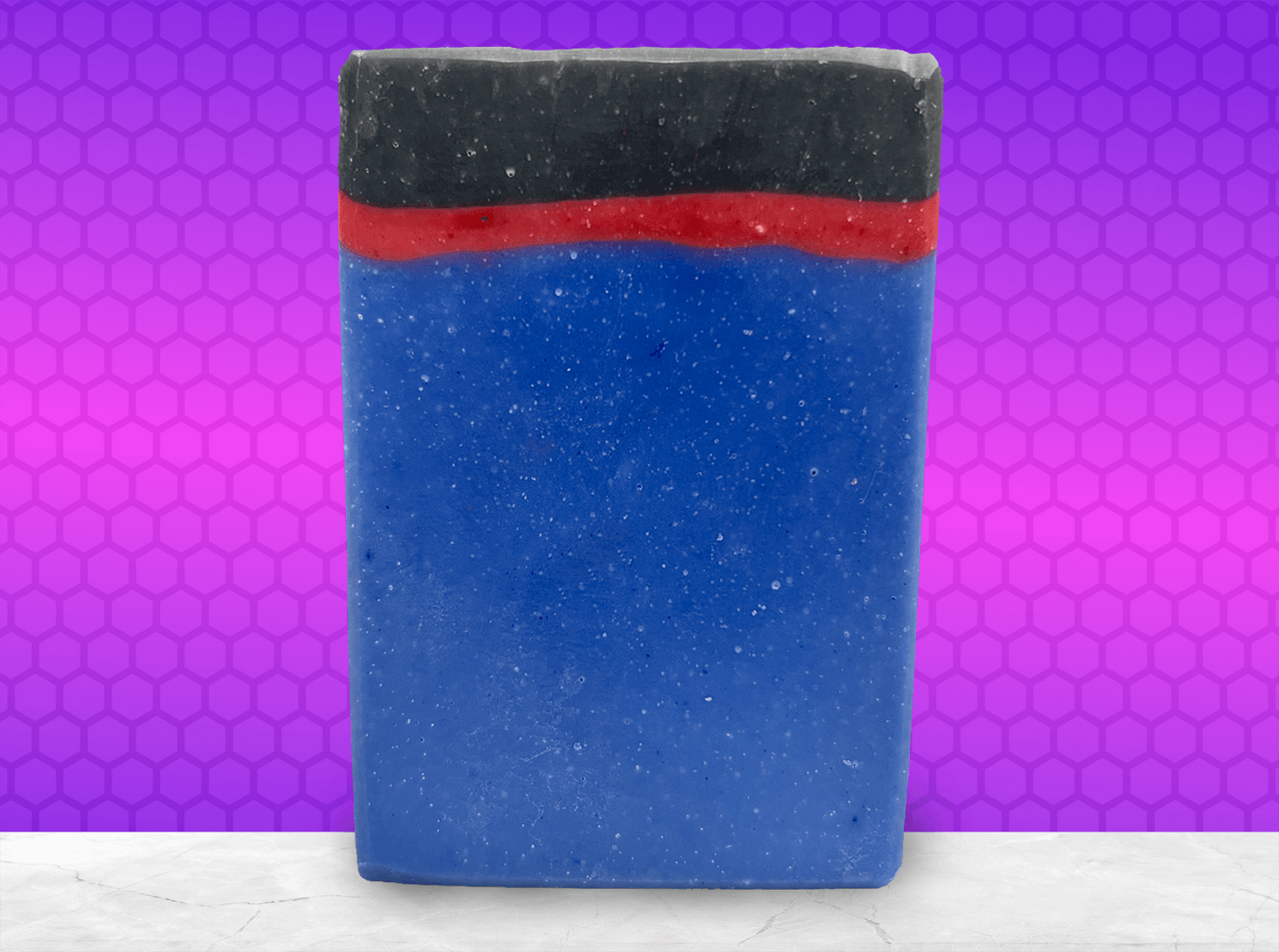 A blue, red and black bar of soap inspired by the uniforms work by the crew on Star Trek: Enterprise. The scent is sea water, a refreshing scent inspired by Jonathan Archer's love for water polo.