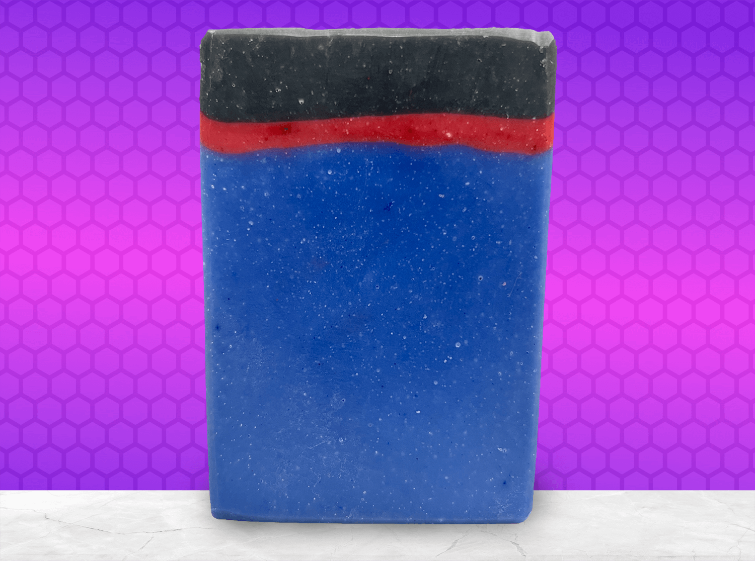 A blue, red and black bar of soap inspired by the uniforms work by the crew on Star Trek: Enterprise. The scent is sea water, a refreshing scent inspired by Jonathan Archer's love for water polo.