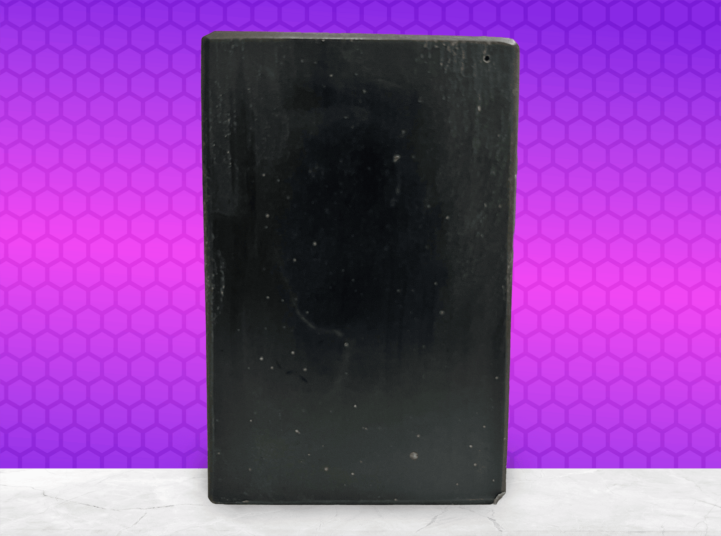 A black bar of pine tar soap inspired by the character Armus from Star Trek: TNG, which looked like a tar pit. The soap is scented with eucalyptus essential oil.