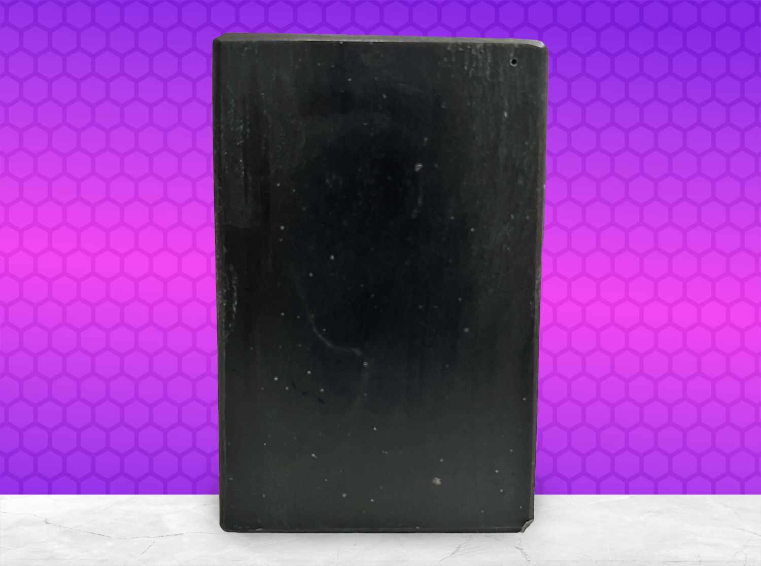 A black bar of pine tar soap inspired by the character Armus from Star Trek: TNG, which looked like a tar pit. The soap is scented with eucalyptus essential oil.