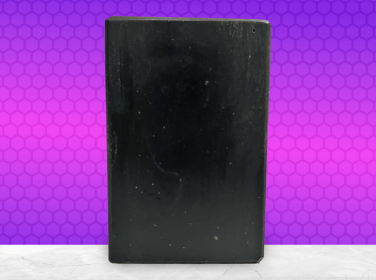 A black bar of pine tar soap inspired by the character Armus from Star Trek: TNG, which looked like a tar pit. The soap is scented with eucalyptus essential oil.