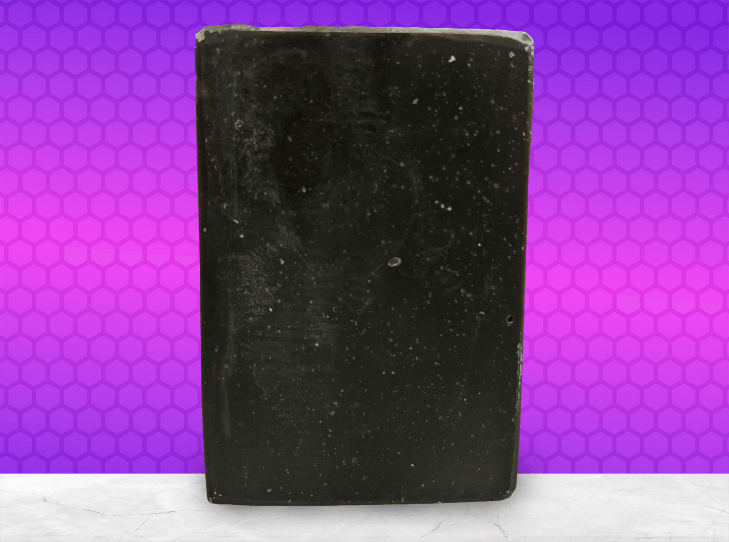 A black bar of pine tar soap inspired by the character Armus from Star Trek: TNG, which looked like a tar pit. The soap is scented with eucalyptus essential oil.