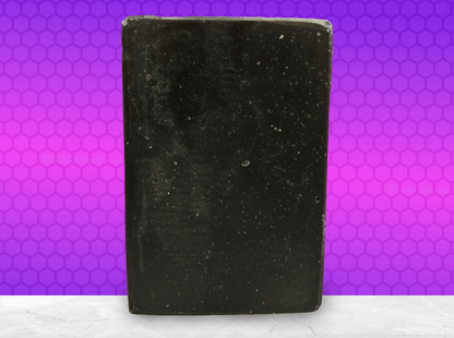 A black bar of pine tar soap inspired by the character Armus from Star Trek: TNG, which looked like a tar pit. The soap is scented with eucalyptus essential oil.