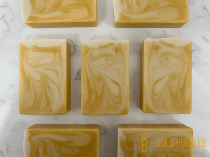 A bar of soap with swirls of varying shades of white and yellow, and a glittery white top. The scent and design was inspired by Bajoran ale, as seen on Star Trek: Deep Space Nine.