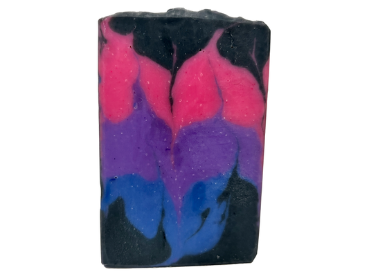 A pink, purple, royal blue, and black bar of soap inspired by the colors of the Bisexual Pride flag, in honor of Pride Month. Proceeds from sales of this soap go to The Trevor Project.