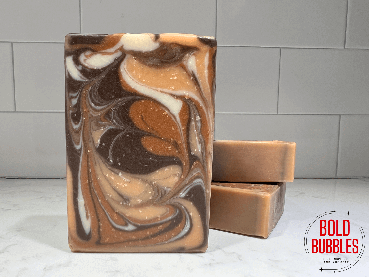 A bar of soap with brown, orange, copper, and white swilrls inspired by the Great Link on Star Trek: Deep Space Nine