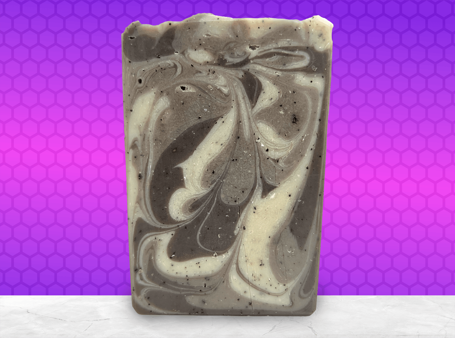 A bar of coffee soap with various shades of brown and cream-colored swirls. It smells like a cafe latte, and it is inspired by Captain Janeway's obsession with coffee on Star Trek: Voyager and Star Trek: Prodigy.