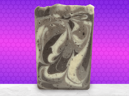 A bar of coffee soap with various shades of brown and cream-colored swirls. It smells like a cafe latte, and it is inspired by Captain Janeway's obsession with coffee on Star Trek: Voyager and Star Trek: Prodigy.