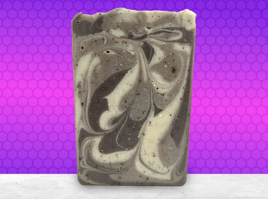 A bar of coffee soap with various shades of brown and cream-colored swirls. It smells like a cafe latte, and it is inspired by Captain Janeway's obsession with coffee on Star Trek: Voyager and Star Trek: Prodigy.