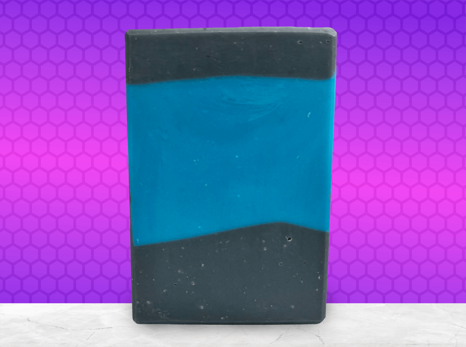 A bar of blue and black soap inspired by the design of the iconic uniforms worn on Star Trek: The Next Generation. The scent is wild rose in honor of Dr. Beverly Crusher.