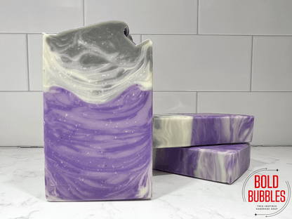 Soap inspired by Dal R'El from Star Trek: Prodigy. It has swirls of purple shades at the bottom and grey at the top.