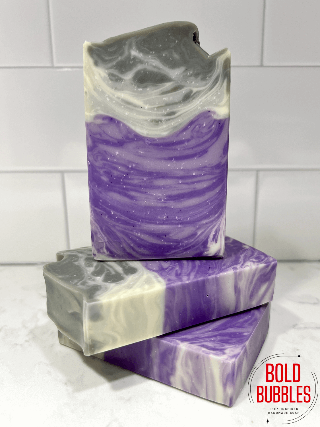 Soap inspired by Dal R'El from Star Trek: Prodigy. It has swirls of purple shades at the bottom and grey at the top.