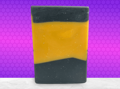A bar of gold and black soap inspired by the design of the uniforms on Star Trek: TNG. This soap is scented with a fragrance called Blue Skies, in honor of Data's famous rendition of the song. It smells like clean cotton.
