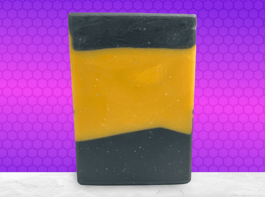 A bar of gold and black soap inspired by the design of the uniforms on Star Trek: TNG. This soap is scented with a fragrance called Blue Skies, in honor of Data's famous rendition of the song. It smells like clean cotton.