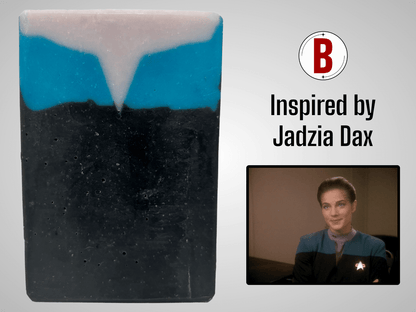 A bar of black, blue, and purplish-grey soap inspired by the look of the uniform worn by Jadzia Dax in the earlier seasons of Star Trek: Deep Space Nine. The scent is cucumber melon.