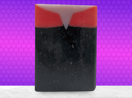 A black, red, and purplish-grey bar of soap inspired by Captain Kathryn Janeway from Star Trek: Voyager. It is scented with an espresso martini fragrance.
