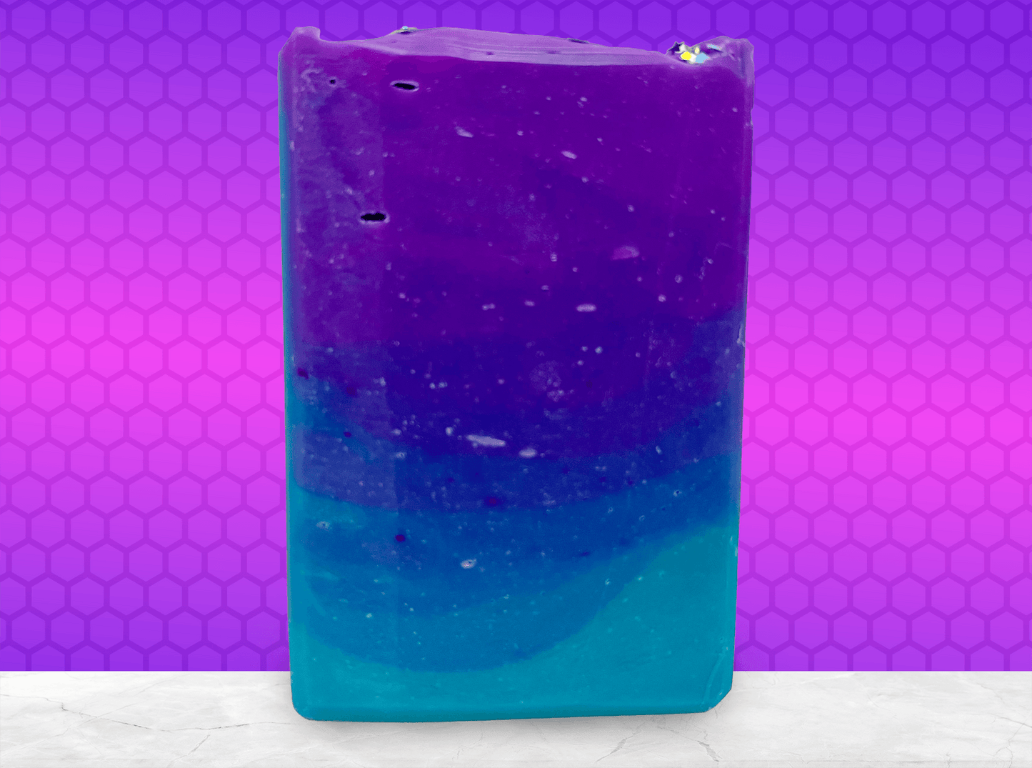 Gradient purple to blue soap bar on a white background. The colors are inspired by Murf from Star Trek: Prodigy, and the scent is fresh mango.