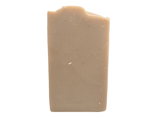 A bar of brownish-colored soap made with colloidal oats. This bar is scented with an oatmeal, milk and honey fragrance.