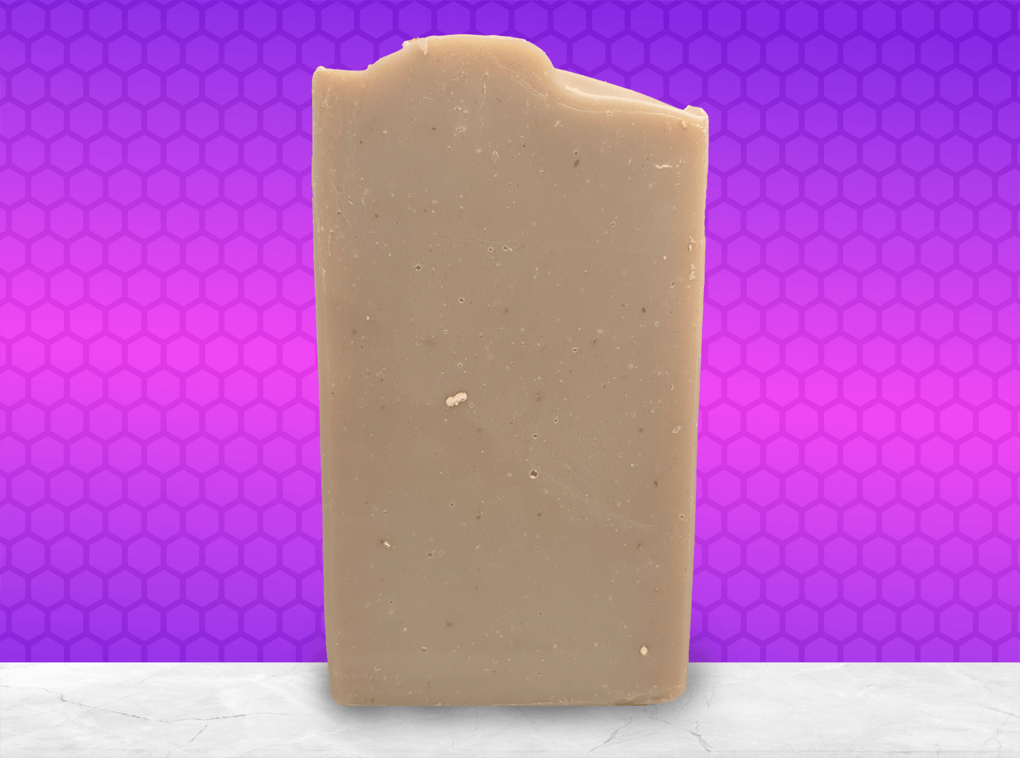 A bar of brownish-colored soap made with colloidal oats. This bar is scented with an oatmeal, milk and honey fragrance.