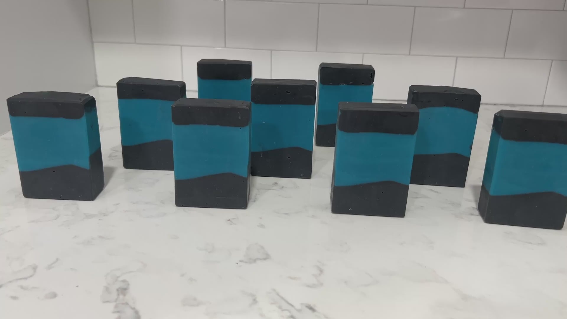 Bars of blue and black soap inspired by the iconic uniforms worn on Star Trek: The Next Generation. The scent is mint frosting, AKA spearmint, in honor of the time Troi became a cellular peptide cake with mint frosting.