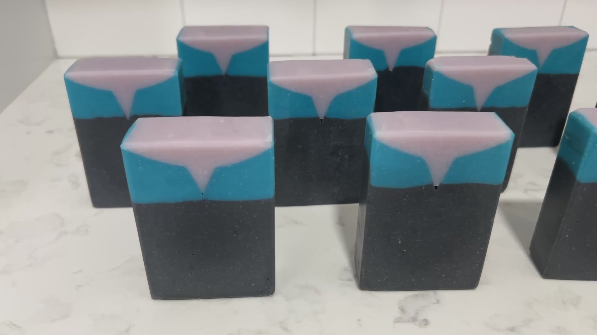Bars of black, blue, and purplish-grey soap inspired by the look of the uniform worn by Jadzia Dax in the earlier seasons of Star Trek: Deep Space Nine. The scent is cucumber melon.