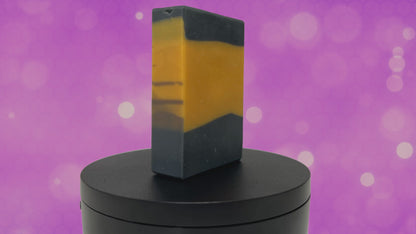 A gold and black bar of soap in the design of the famous TNG-style uniform. The scent is lilac, in honor of Worf.