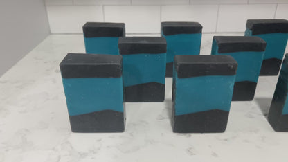 Bars of blue and black soap inspired by the design of the iconic uniforms worn on Star Trek: The Next Generation. The scent is wild rose in honor of Dr. Beverly Crusher.
