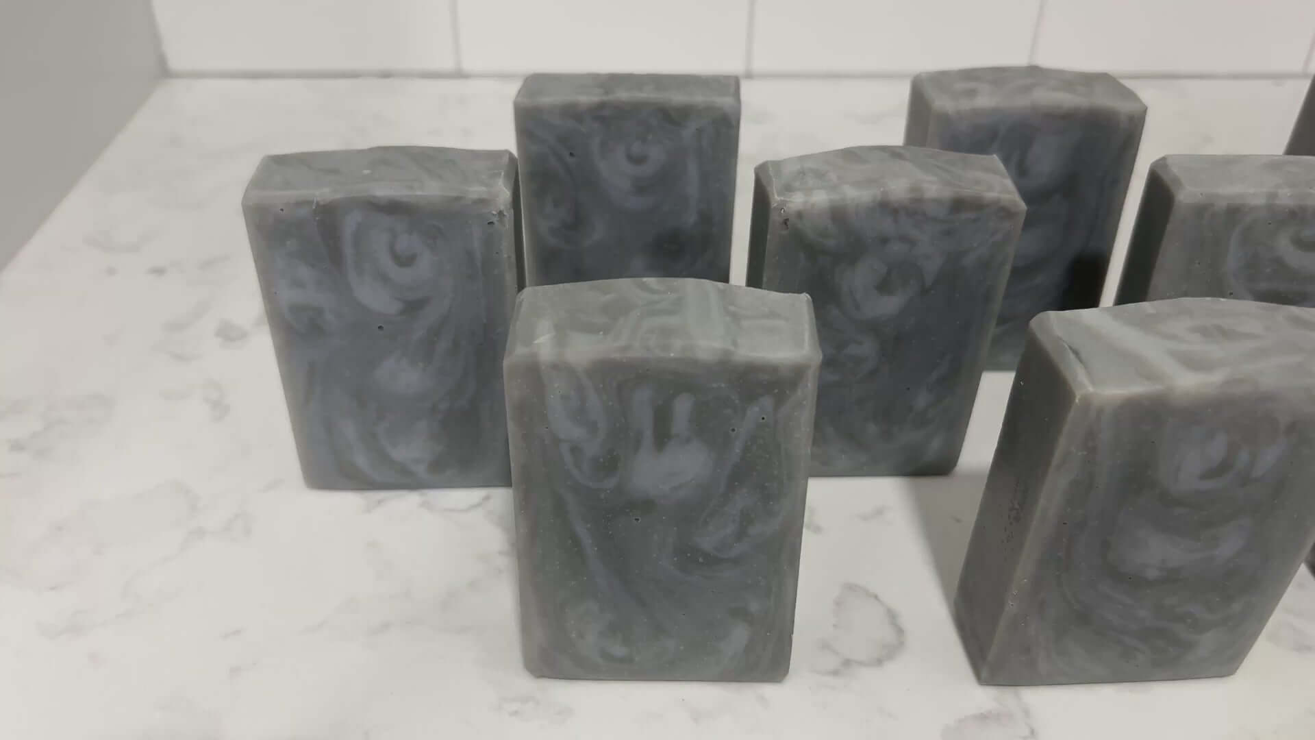 Swirled bars of unscented soap with two shades of grey. They are inspired by Garak from Star Trek: Deep Space Nine.