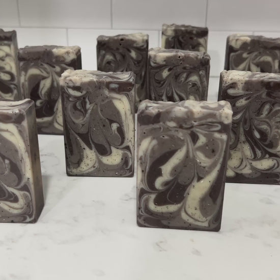 Bars of coffee soap with various shades of brown and cream-colored swirls. It smells like a cafe latte, and it is inspired by Captain Janeway's obsession with coffee on Star Trek: Voyager and Star Trek: Prodigy.