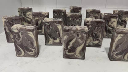Bars of coffee soap with various shades of brown and cream-colored swirls. It smells like a cafe latte, and it is inspired by Captain Janeway's obsession with coffee on Star Trek: Voyager and Star Trek: Prodigy.