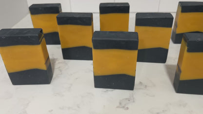 Gold and black bars of soap in the design of the famous TNG-style uniform. The scent is lilac, in honor of Worf.
