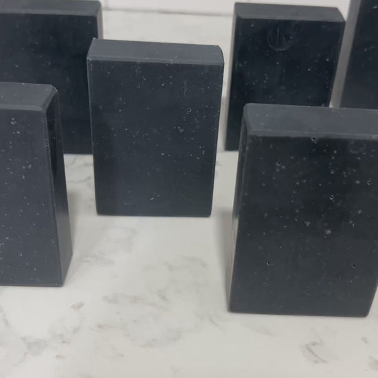 Black bars of activated charcoal soap inspired by the character Armus from Star Trek: TNG. 