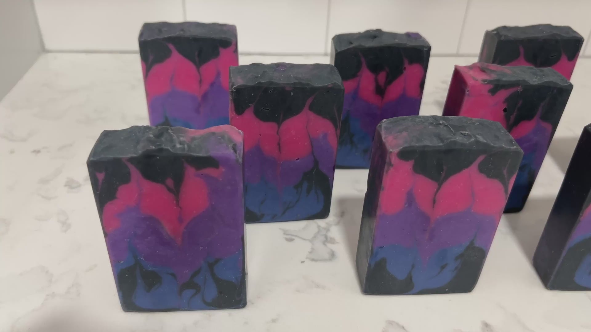 Pink, purple, royal blue, and black bars of soap inspired by the colors of the Bisexual Pride flag, in honor of Pride Month. Proceeds from sales of this soap go to The Trevor Project.