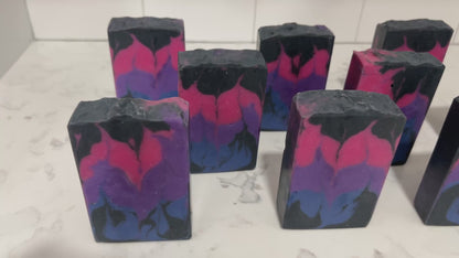 Pink, purple, royal blue, and black bars of soap inspired by the colors of the Bisexual Pride flag, in honor of Pride Month. Proceeds from sales of this soap go to The Trevor Project.