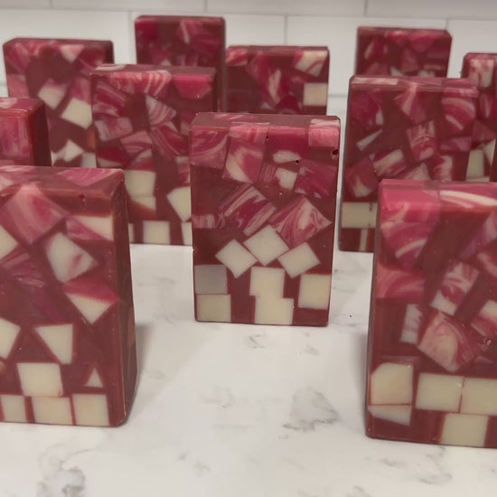 Bars of soap made up of red and white cubes, with brick red filling in the gaps. The soap is inspired by Rok-Tahk, the Brikar, from Star Trek: Prodigy. It smells like red berries and rhubarb.