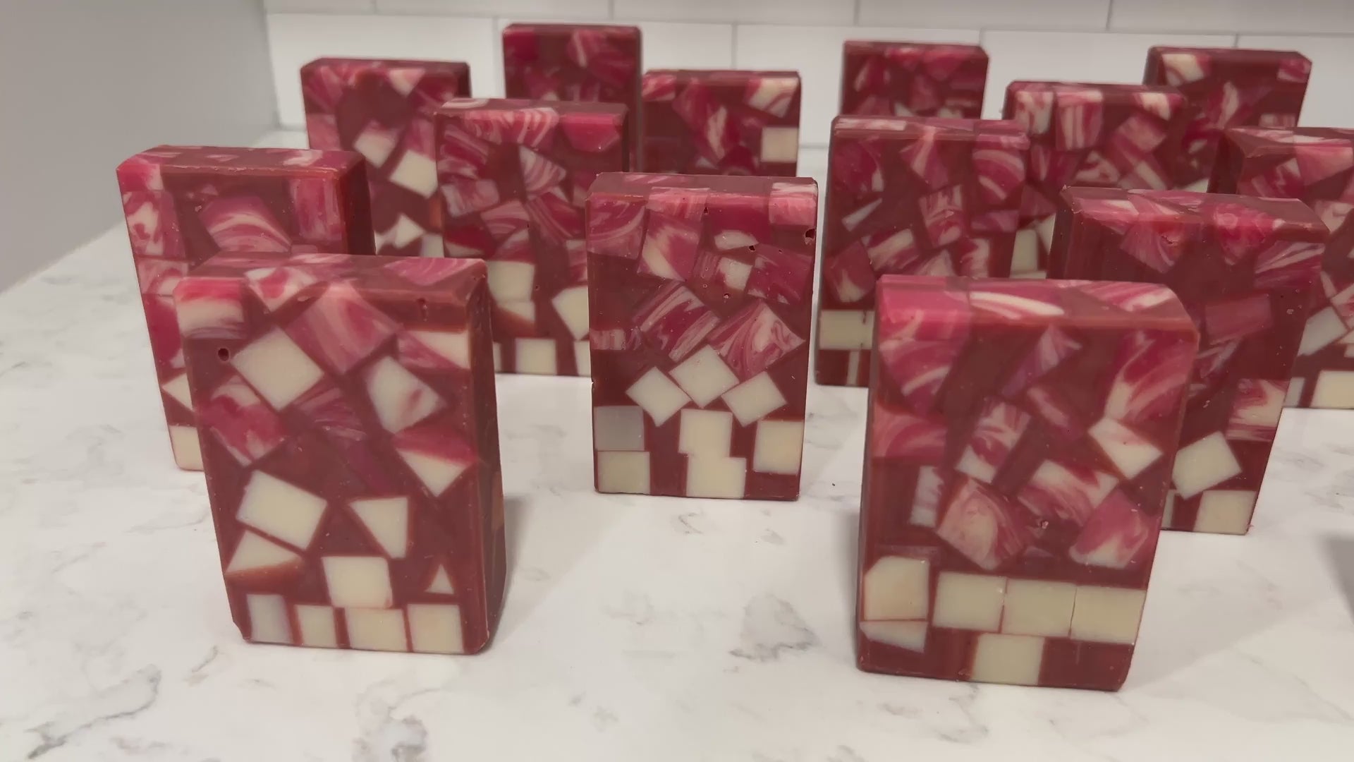 Bars of soap made up of red and white cubes, with brick red filling in the gaps. The soap is inspired by Rok-Tahk, the Brikar, from Star Trek: Prodigy. It smells like red berries and rhubarb.
