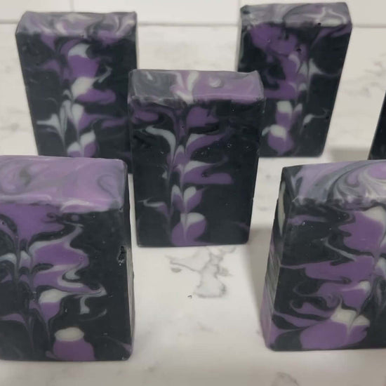 Black, purple, and white bars of soap inspired by the look of the Crystalline Entity as seen in Star Trek TNG's "Silicon Avatar."