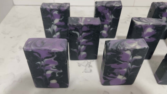 Black, purple, and white bars of soap inspired by the look of the Crystalline Entity as seen in Star Trek TNG's "Silicon Avatar."