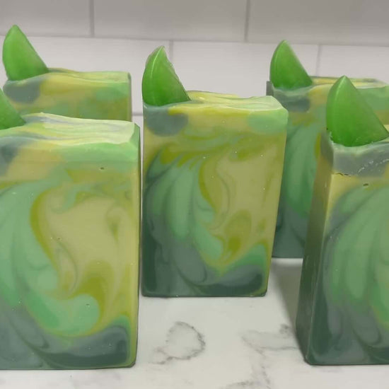 Bars of seven-color green swirled soap made with an intoxicating fresh lime fragrance, and a little lime garnish on top. They are inspired by the Seven of Limes drink mentioned in Star Trek: Discovery.