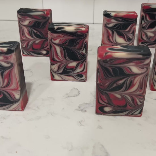 Red, black and white swirled bars of soap inspired by Q from Star Trek.