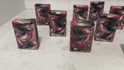 Red, black and white swirled bars of soap inspired by Q from Star Trek.