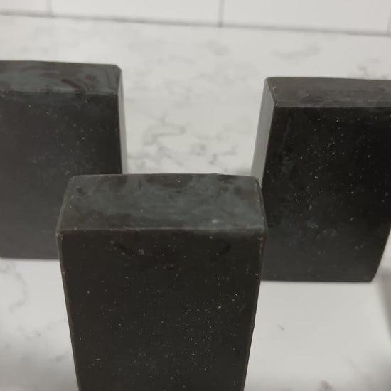 Bars of black pine tar soap inspired by the character Armus from Star Trek: TNG, which looked like a tar pit. The soap is scented with a blend of eucalyptus and cedar essential oils.