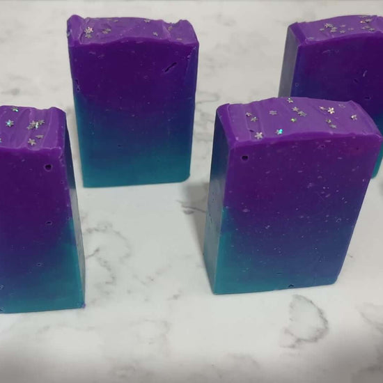 Gradient purple to blue soap bar on a white background. The colors are inspired by Murf from Star Trek: Prodigy, and the scent is fresh mango.
