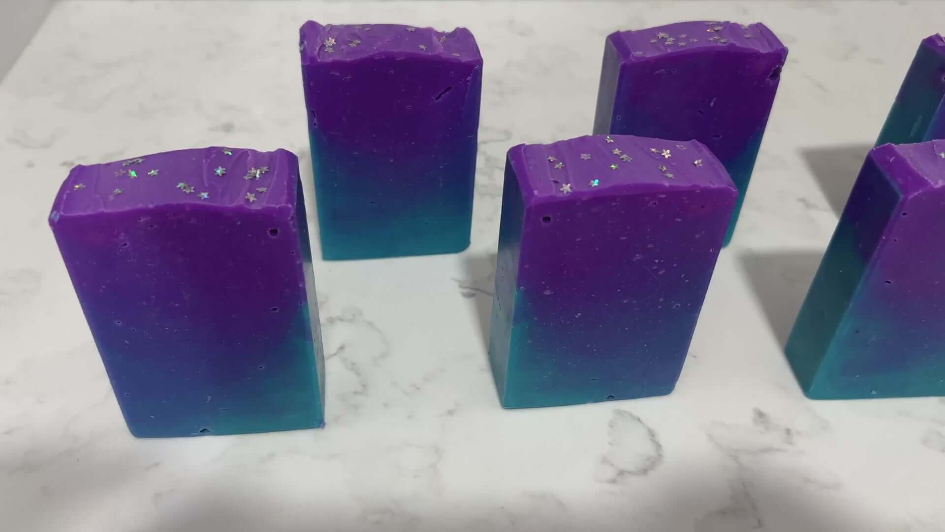 Gradient purple to blue soap bar on a white background. The colors are inspired by Murf from Star Trek: Prodigy, and the scent is fresh mango.