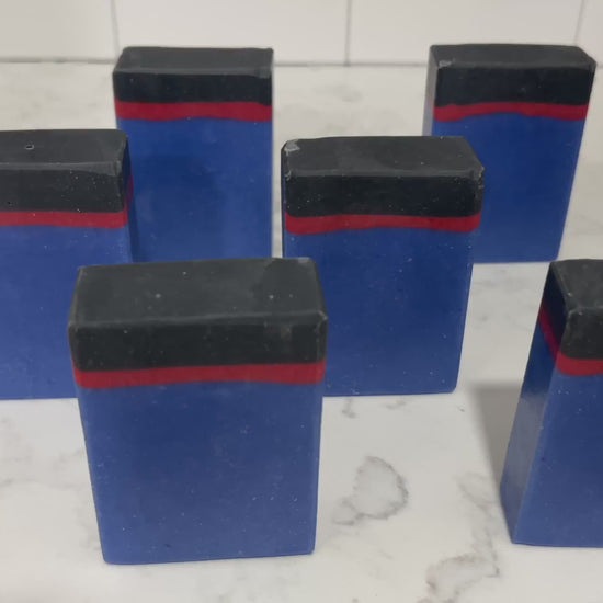 Blue, red and black bars of soap inspired by the uniforms work by the crew on Star Trek: Enterprise. The scent is sea water, a refreshing scent inspired by Jonathan Archer's love for water polo.