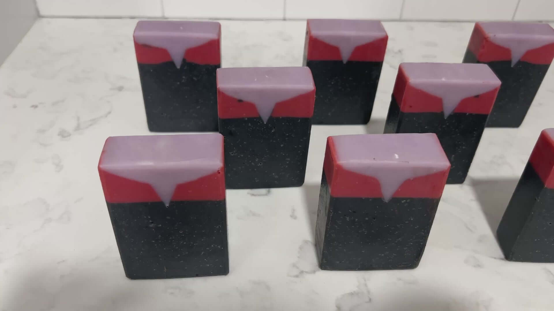Black, red, and purplish-grey bars of soap inspired by Captain Kathryn Janeway from Star Trek: Voyager. It is scented with an espresso martini fragrance.