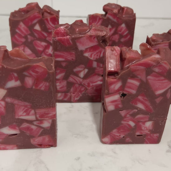 Bars of soap made up of red and white cubes, with brick red filling in the gaps. The soap is inspired by Rok-Tahk, the Brikar, from Star Trek: Prodigy. It smells like red berries and rhubarb.